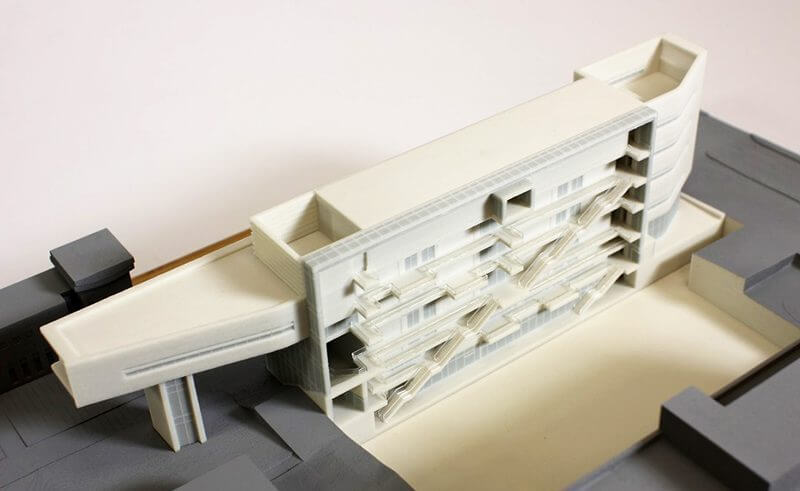 Complex section view of a mid rise apartment 3d printed in two tone architectural model of apartment complex cutaway